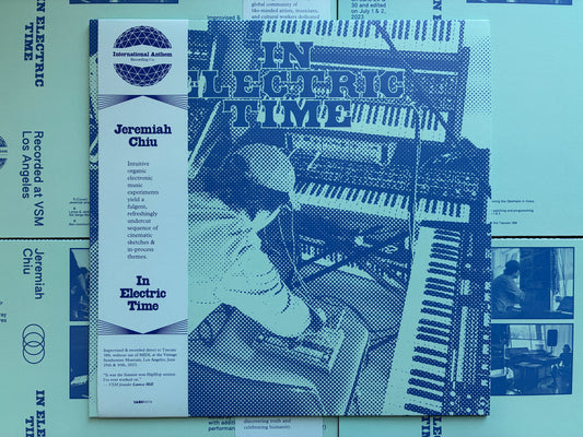 In Electric Time front cover with OBI strip [Vinyl]